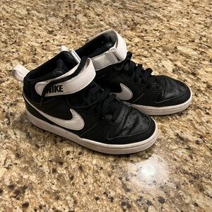 Boys black Nike shoes